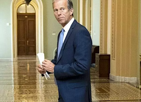 john thune looks back in an empty hall on capitol hill